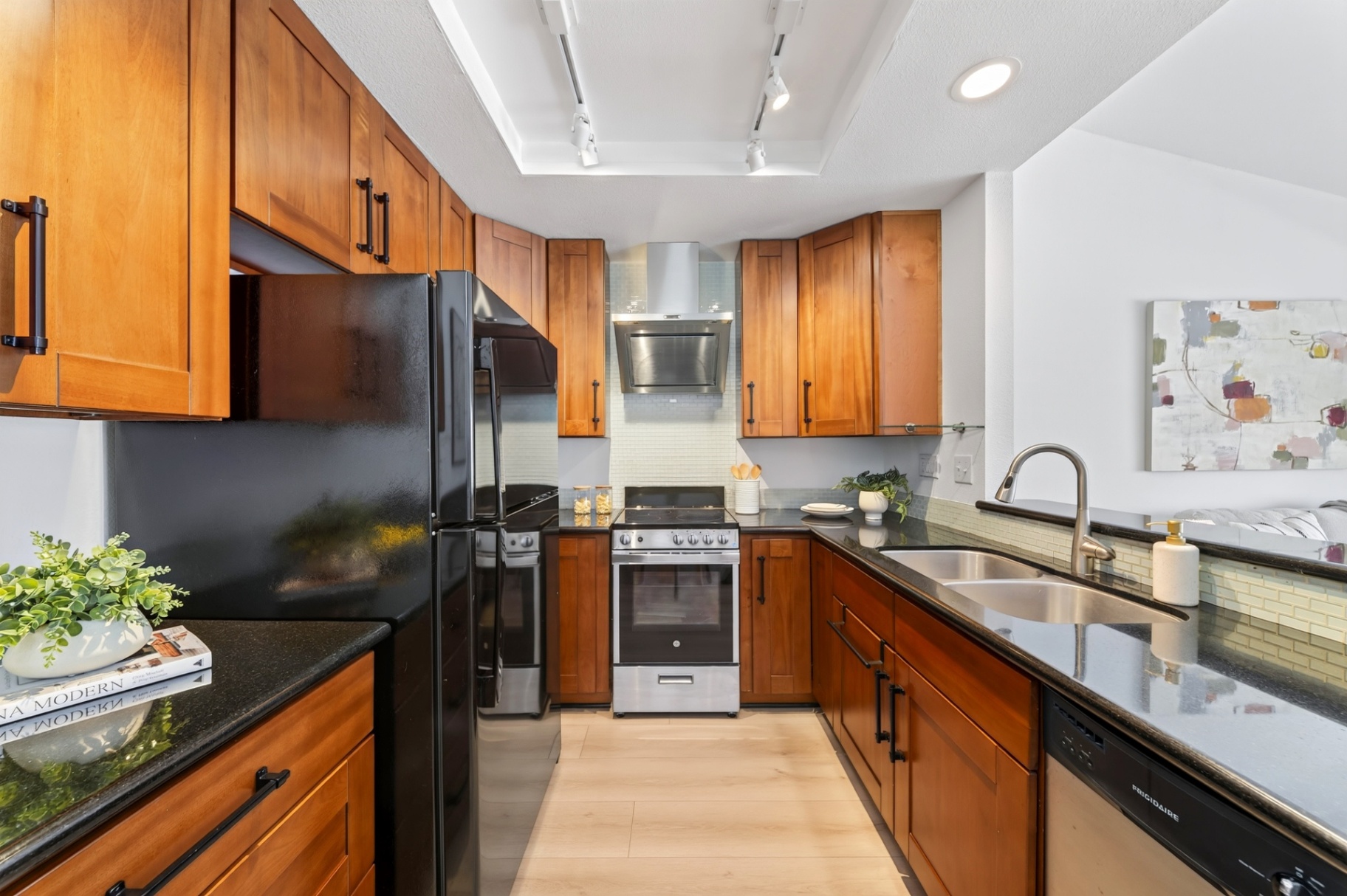 Kitchen with wood cabinetry and stainless appliances